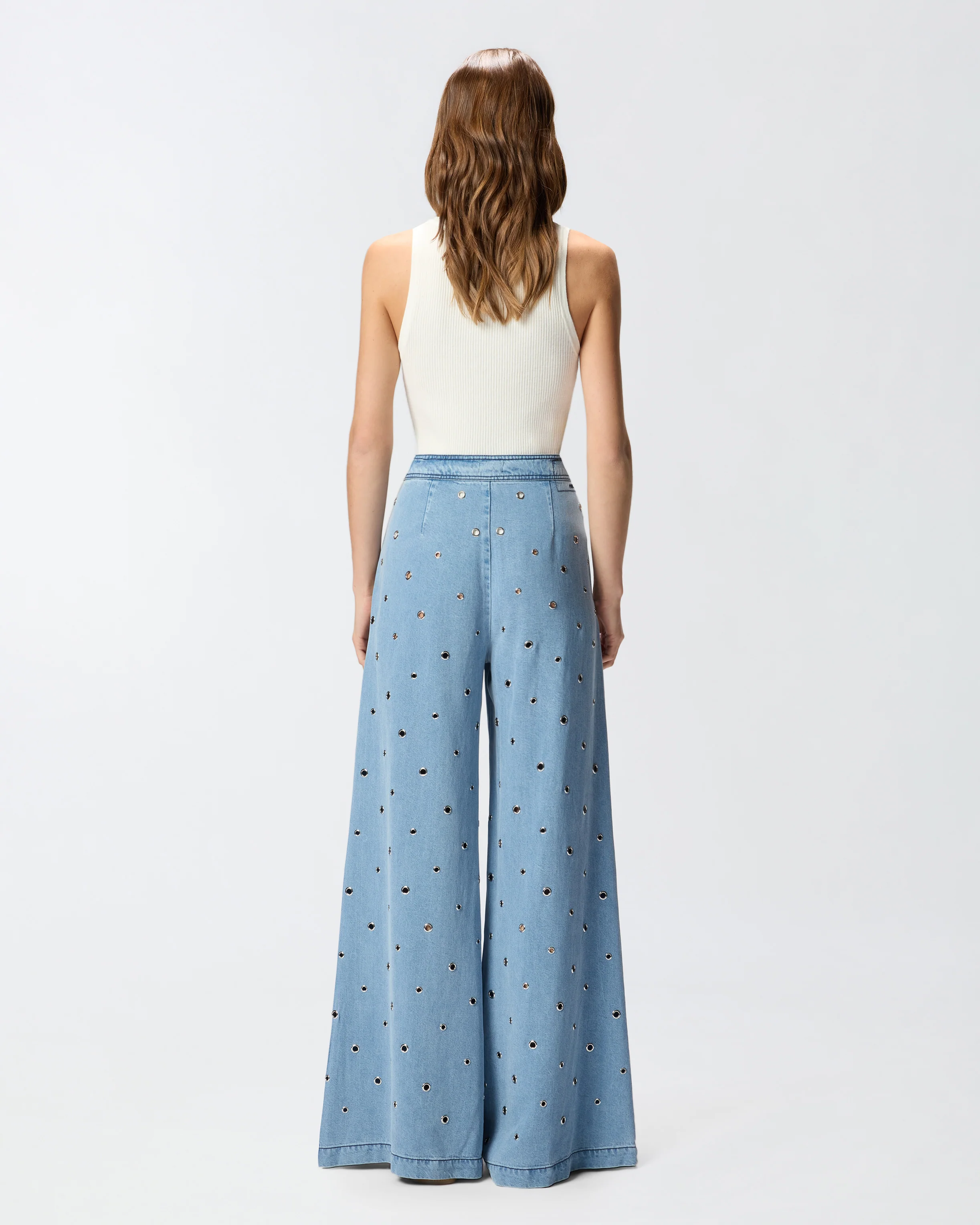 Jeans in denim con occhielli - Image 3